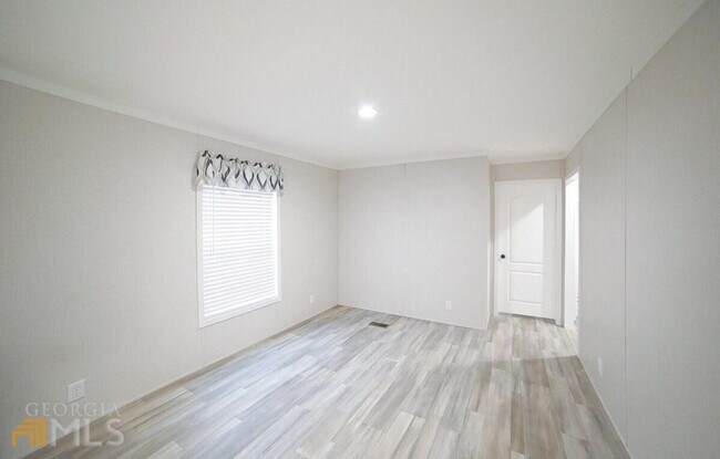Building Photo - Spacious 4-Bedroom Home with Lawn Maintena...