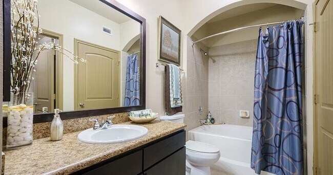 Building Photo - Spacious Living with Urban Convenience!