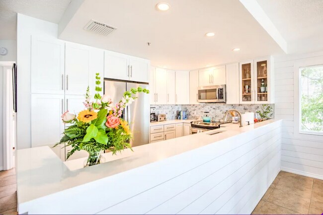 Open kitchen with brand new electric stove - 96 Ave C