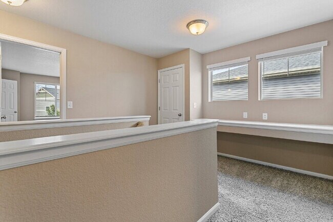 Building Photo - Spacious Banning Lewis Home with Finished ...