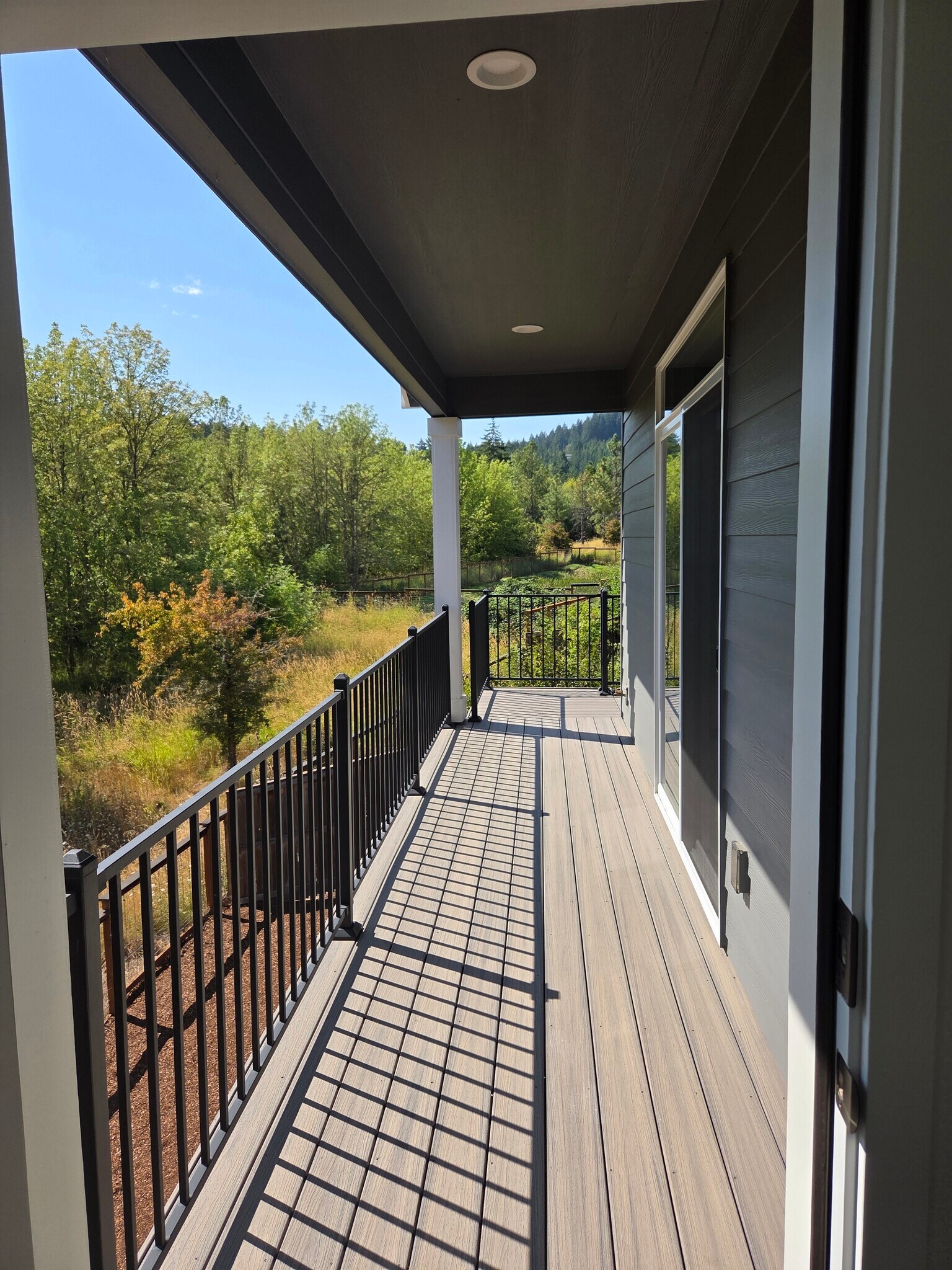 deck overlooking trees - 5450 NW Stardown Dr