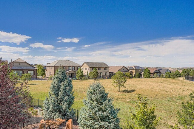 Building Photo - Beautifully maintained 5-bedroom home with a large finished basement, club access, and top-rated ...