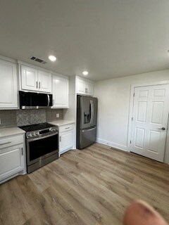 Solid wood cabinets and new vinyl plank flooring - 4714 29th St
