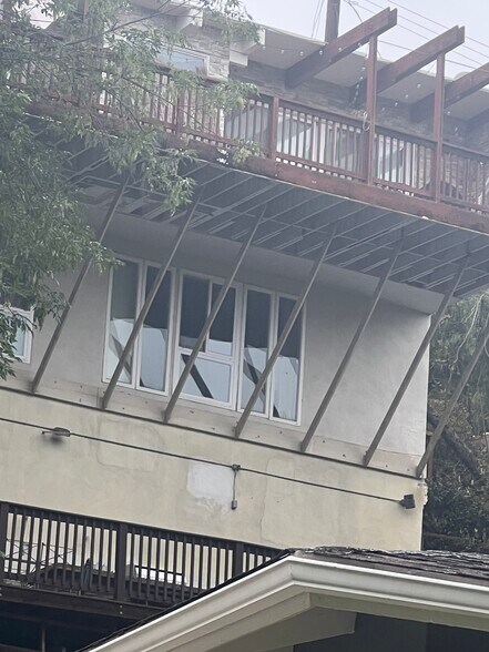View of house from Distance. Rental unit is underneath the main house on top - 2300 Sunset Heights Dr
