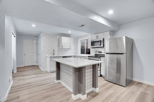 Building Photo - $3,295.95 - 3 bed, 2 bath updated Home in Littleton with Two Full Kitchens and Impressive Yard!