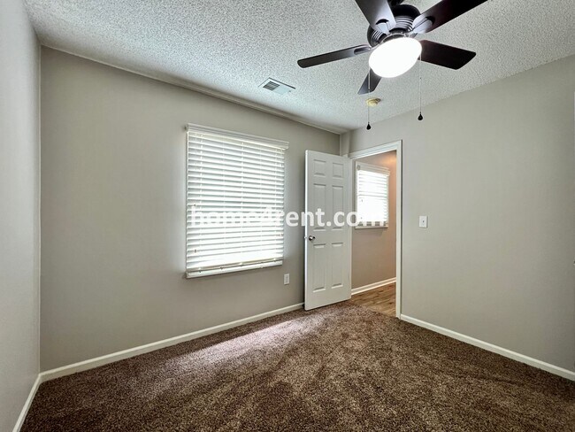 Building Photo - Updated Kitchen, Large Two Tiered Deck, Finished Basement in Blue Valley Schools!