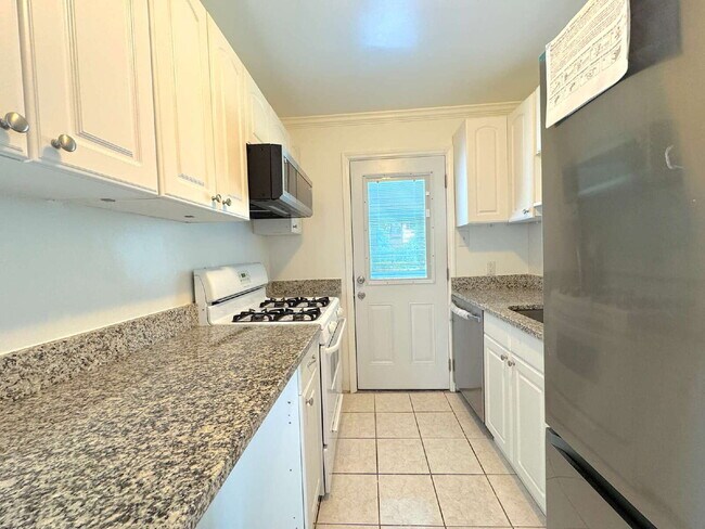 Building Photo - Charming 2BR Townhome with Finished Basement, Fenced Yard & Private Driveway Near Huntington Metro
