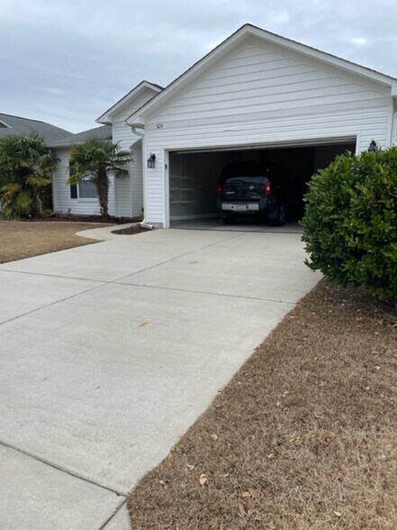 two-car garage, two spaces in driveway - 824 Wintercreeper Dr