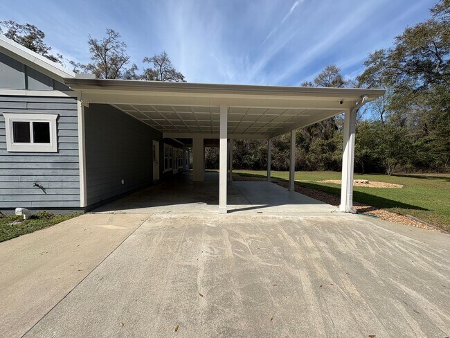 Building Photo - Available Now: Expansive 4BR Home with Rare 3-Bay Carport