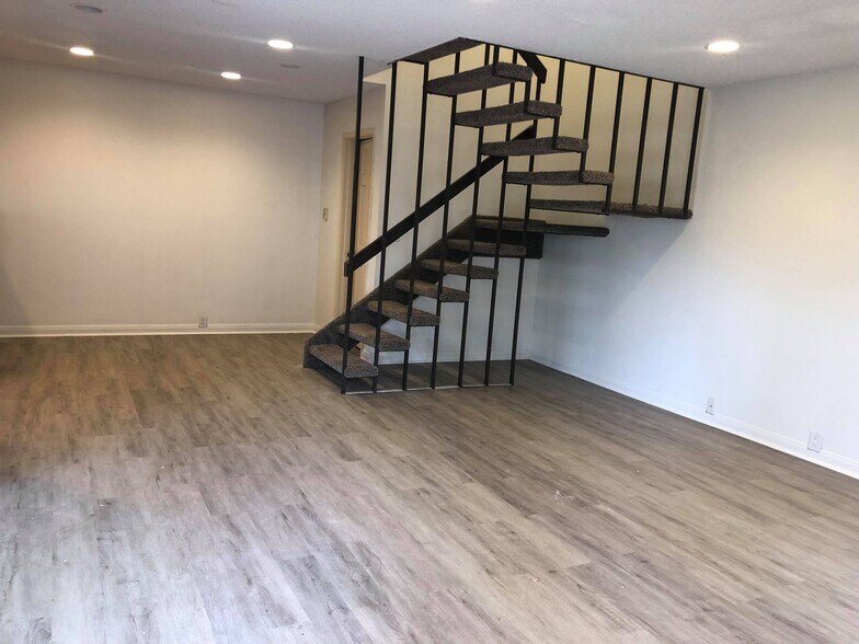 Living area, dining area, and half bathroom in the back - 9594 Easter Way