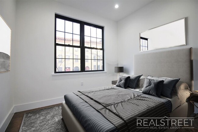 Building Photo - Stunning Brand New 2 BED with W/D in unit!