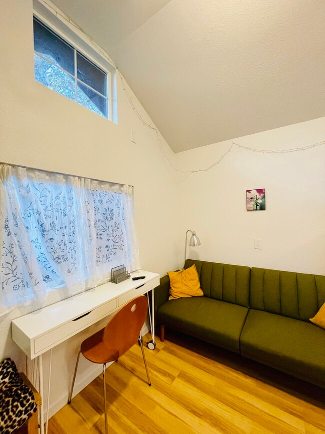 Lots of windows for cross breeze. Midmod couch pulls out. - 3405 NE 80th Ave