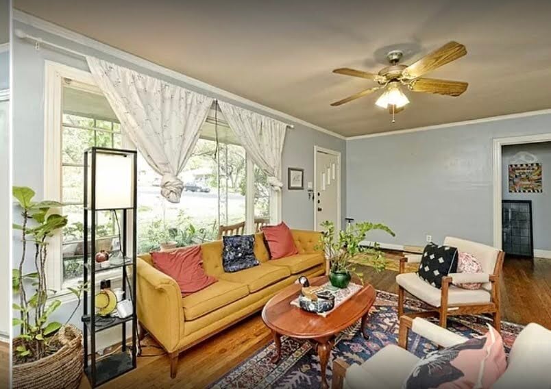 Unit A Pre-Reno Living Room with Front Door - 4000 Crescent Dr