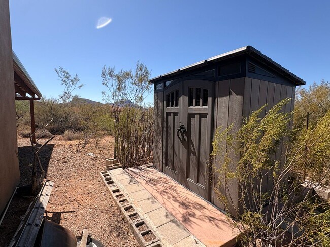 Building Photo - Desert Home on 3.3 Acres with Rooftop Views & Unique Rammed Earth Design