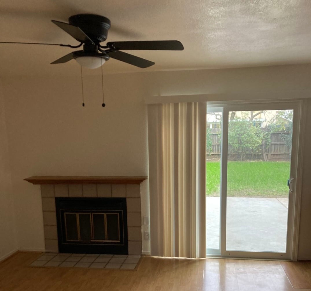 Family room with fireplace and sliding glass doors to patio - 6744 N Warren Ave