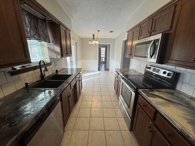 Building Photo - 3 BEDROOM  2 BATH 2 CAR GARAGE SITTING ON A CORNER LOT.  FEATURES INCLUDE: WASHER & DRYER HOOKUPS...