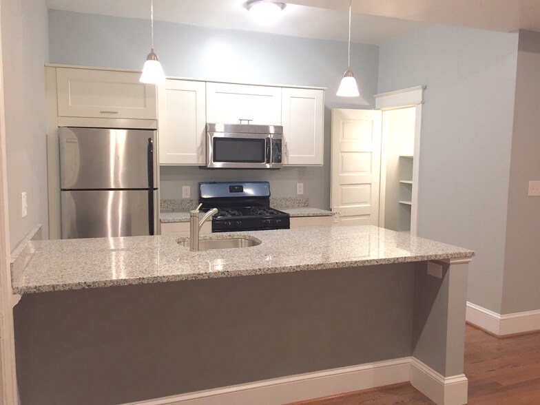 Large granite peninsula with room for stools. - 1110 4th St NE