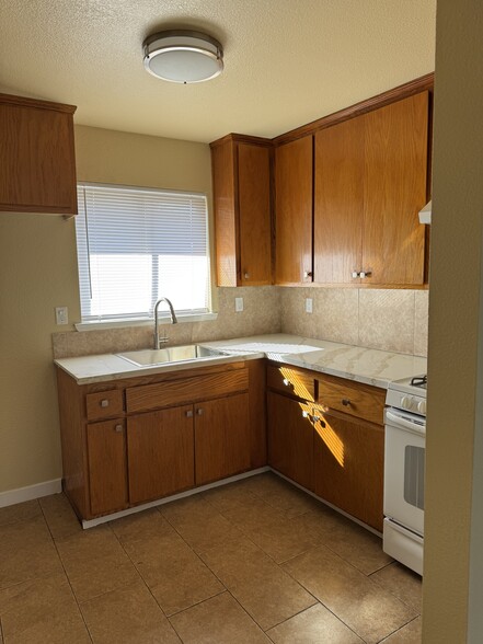 kitchen w updated counter, sink, faucet - 2227 16th Ave