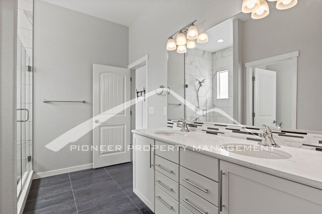 Building Photo - Elegant Ranch-Style Home with Main Floor Primary Bedroom with 3-Car Garage and Finished Basement ...