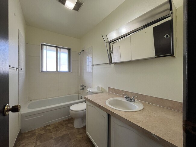 Building Photo - Spacious 3 Bedroom with Bonus Living Area, Patio & Built in Fireplace