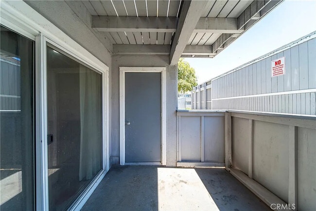 Building Photo - Bright 2-Bed Condo with Central Air, Pool Access & Carport in Anaheim
