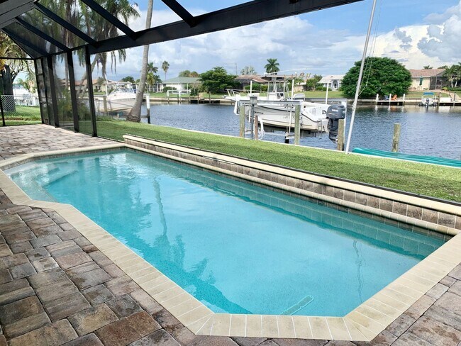 Building Photo - AVAILABLE 2027 SEASON! ! PGI HEATED POOL, WATERFRONT, BOAT LIFT