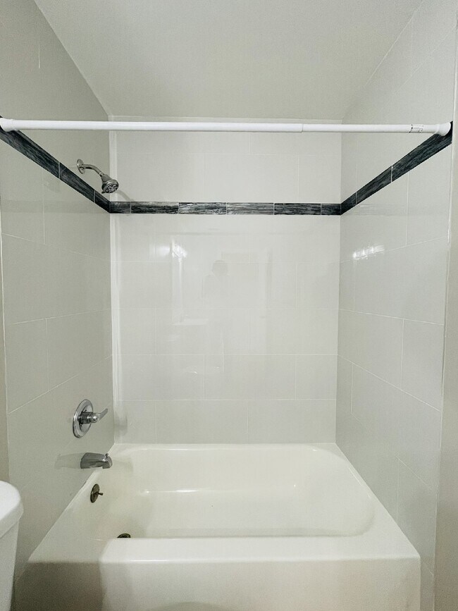 Building Photo - Updated 2-bedroom waterfront duplex with walk-in closets, enclosed Florida room, and canal views ...