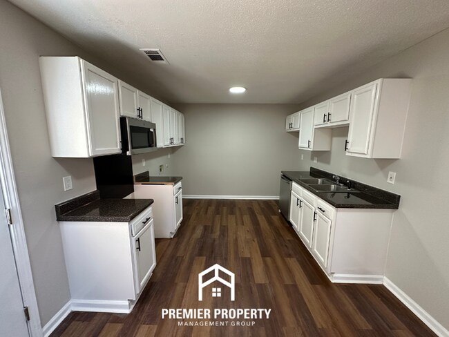 Building Photo - Spacious 4BR/2BA Home in 38141 | Vinyl Flooring & Large Fenced Backyard