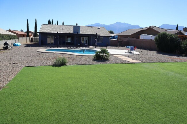 Building Photo - Home With A Pool and Much More!