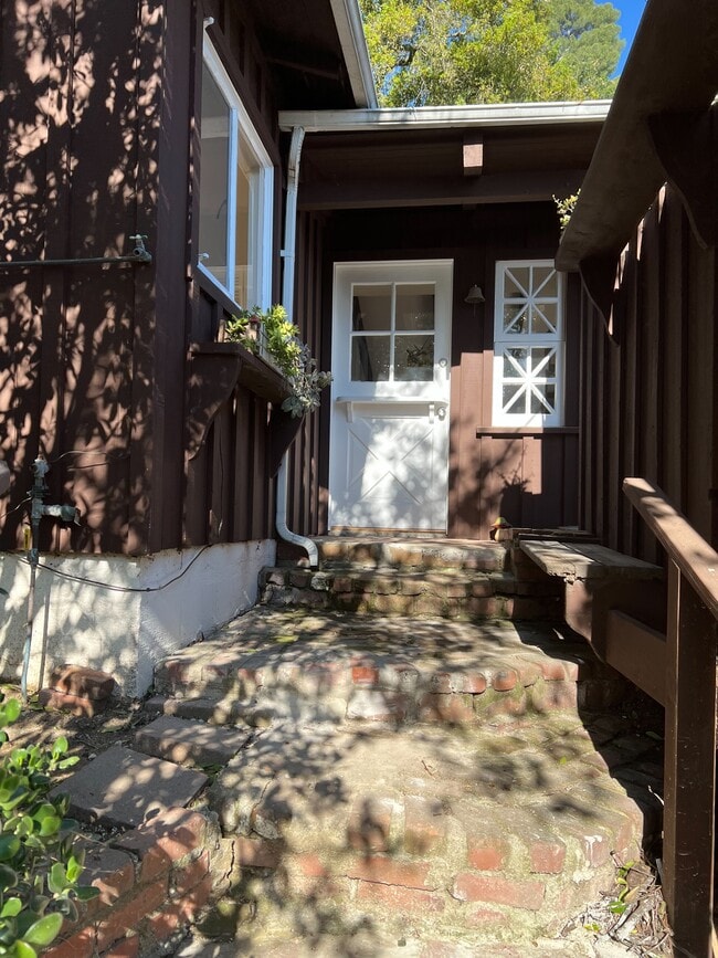 Stairway leading to the front door. - 2021 Rosilla Pl