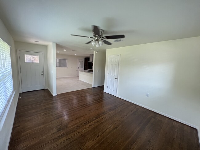 View from living room into kitchen. - 6015 Heffernan St