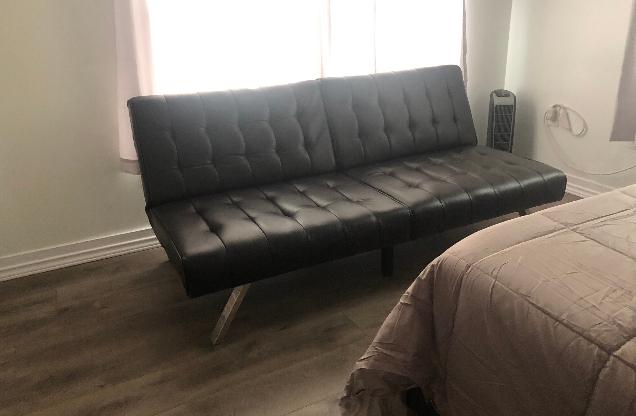 sofa in bedroom 1 - 2427 W Southcross Blvd