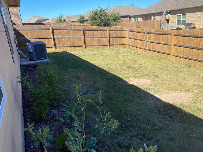 Building Photo - Three Bedroom, Two Bath, Two Car Garage, Washer and Dryer are included.