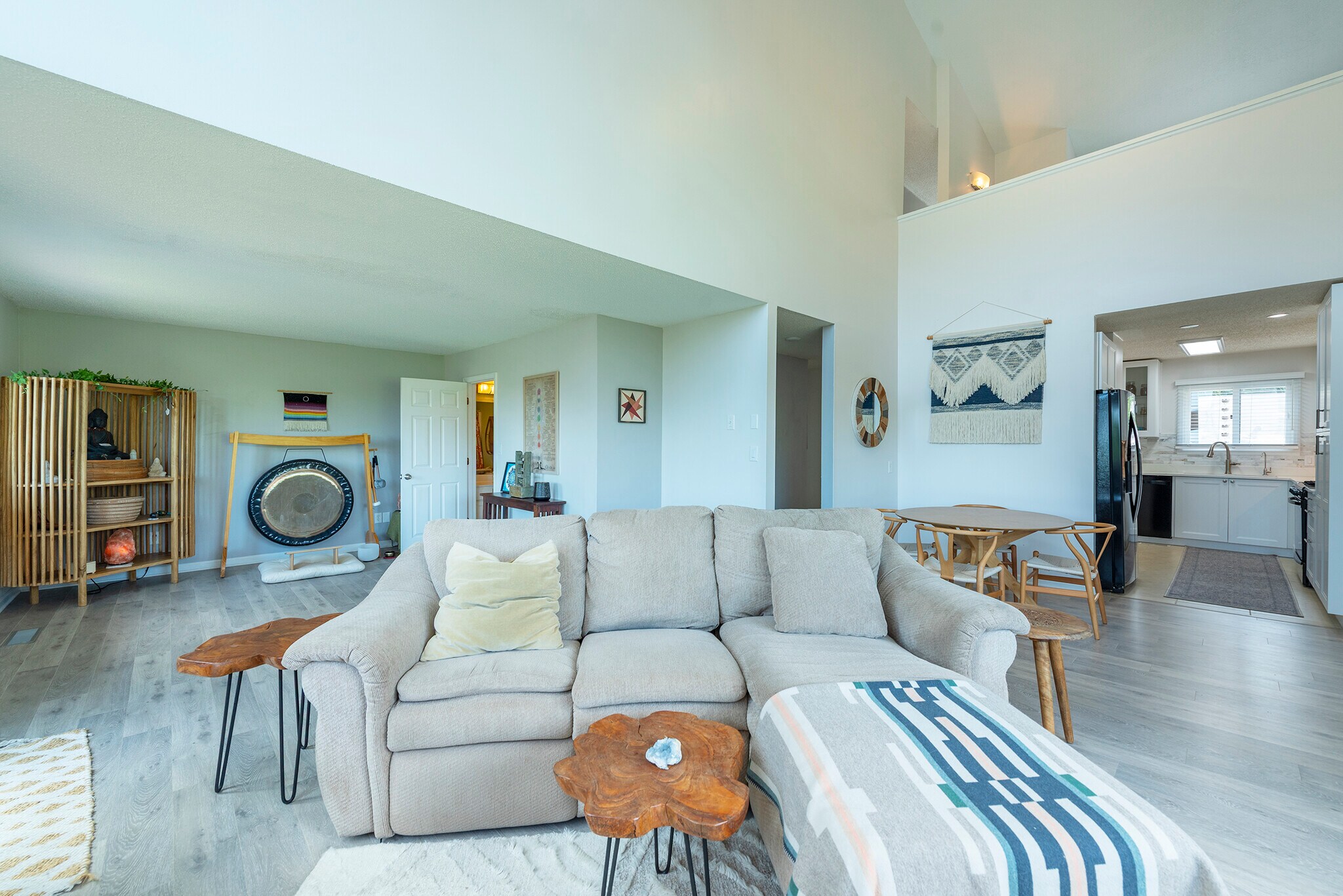 Spacious open-concept living area with soaring high ceilings, featuring seamless flow . - 405 Windswept Dr