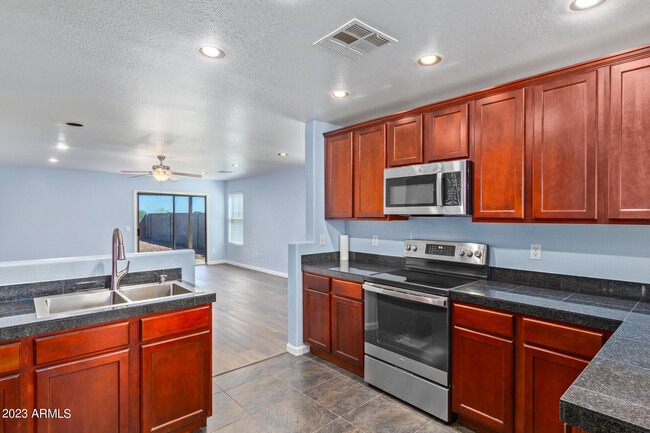 Building Photo - 36532 W Barcelona Ln