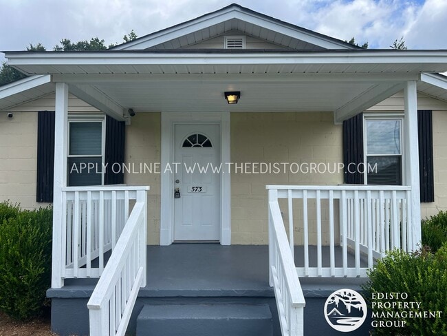 Primary Photo - Charming 3BR Home with Screened Porch & Sp...