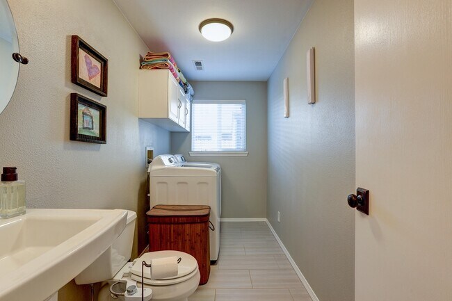 Laundry Room and downstairs bathroom - 1086 NE Locksley Dr