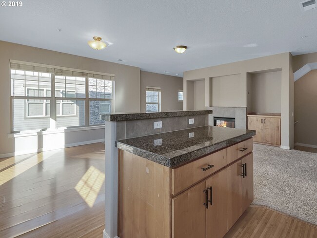Building Photo - 2BR + 2.1BA Corner Townhome-Style Condo — Dual Primary Suites, Attached Garage & Most Utilities I...
