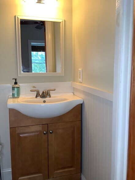 Powder room off main level office. - 9 Jay St