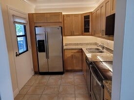 Kitchen with secondary entrance - 20400 W Country Club Dr