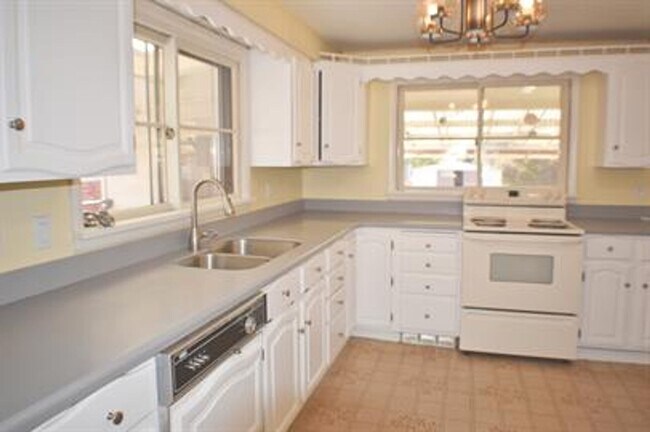 Building Photo - Updated house with original hardwoods and 2-car garage!