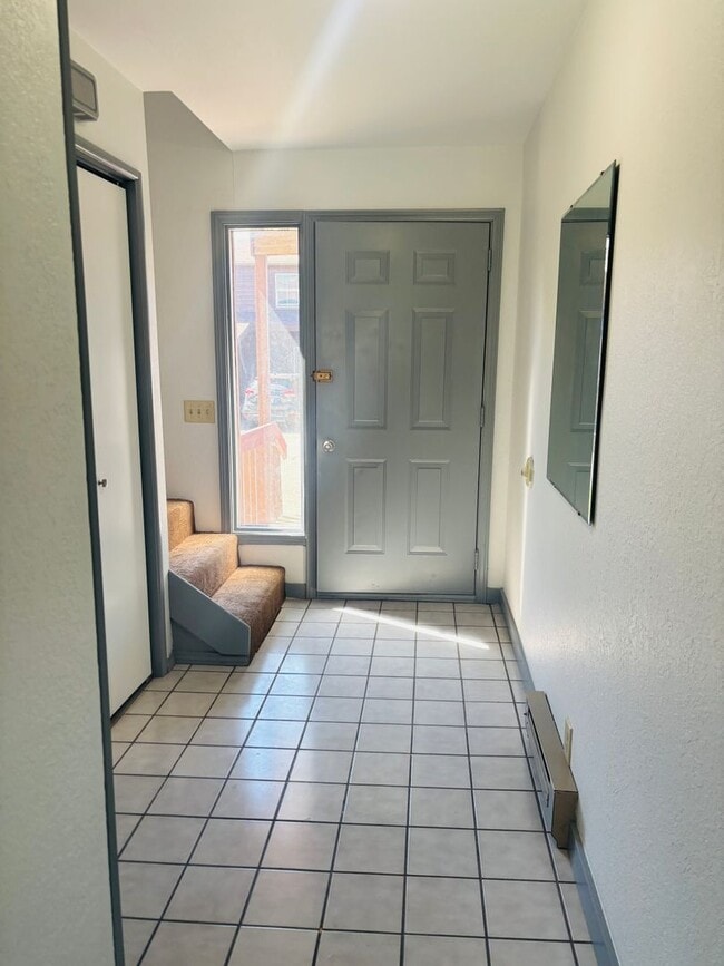 Building Photo - Renovated 3BR condo w/ garage & private yard **MOVE IN SPECIAL - $100 off each month**