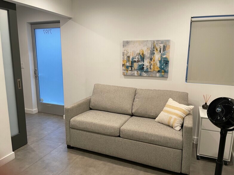 1st Floor guest room / office with a comfortable pull-out sofa. Sliding Barn door & ensuite bathroom - 7197 Formosa Fusion Ct