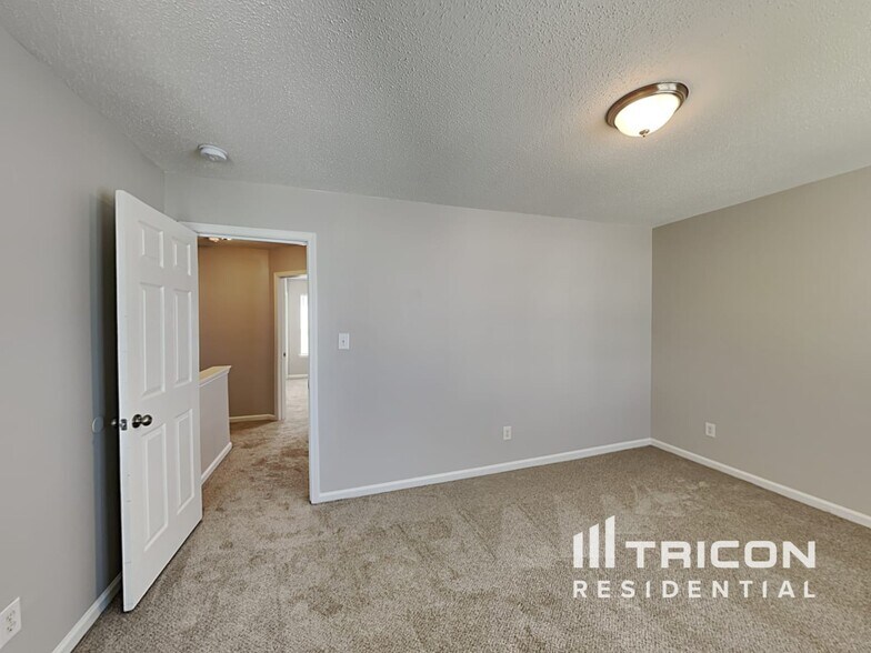 Building Photo - 9234 Tiger Lily Ln