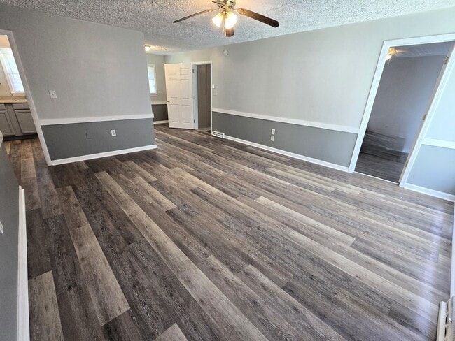 Building Photo - 3/2 with Fenced Yard; In-town and Near an ...