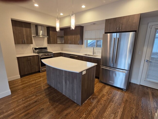 Building Photo - STUNNING 4-LEVEL TOWNHOME IN HIGHLANDS WITH SAUNA, 2-CAR GARAGE + AMAZING ROOFTOP DECK!