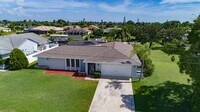 Building Photo - Gulf Access Pool Home. 4BED/2BATH. SE OF CAPE CORAL FL. Special Offer! Qualify for a deposit-free...