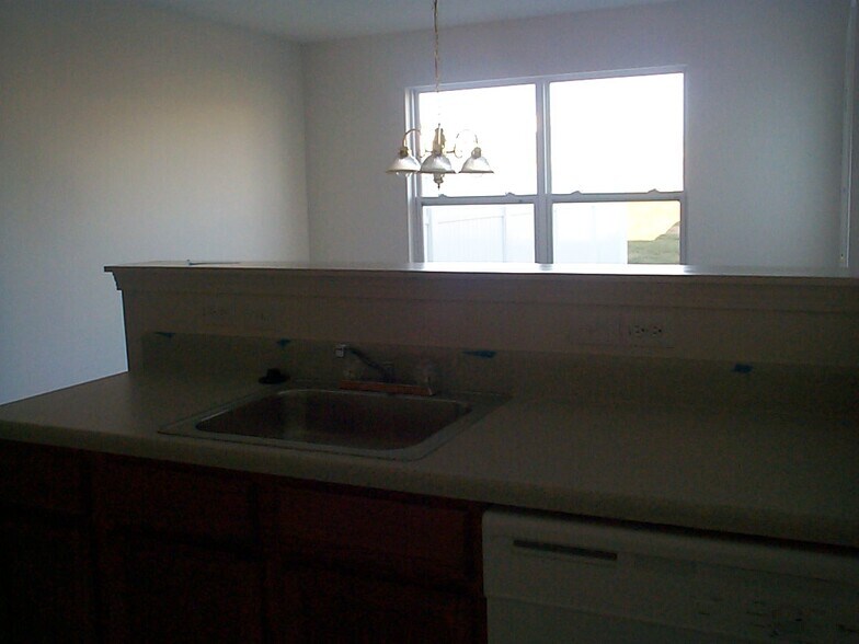 Kitchen Note this pic was taken before the walls were painted and the backsplash was added behind the sink. - 6434 Ziegler Ln