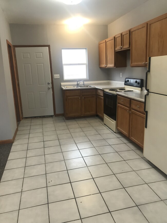 Kitchen facing entry door - 278 E 6th St