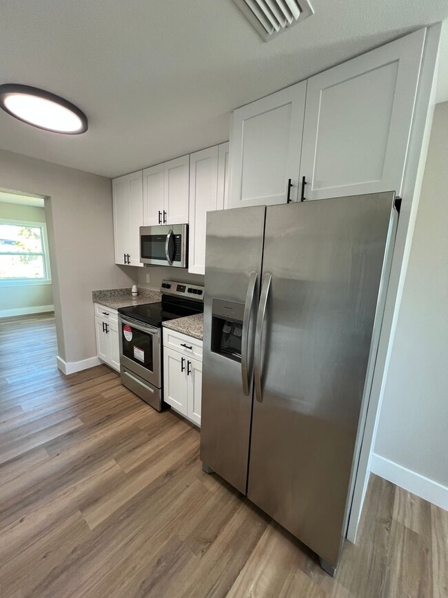 Building Photo - Totally updated !!  All new interior.  Bri...